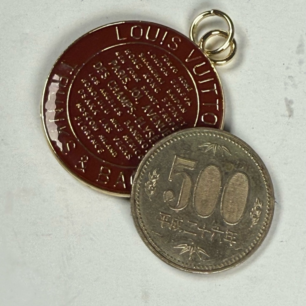 Louis Vuitton Carmel brown and Gold Coin Pendant two-sided pendent. Coin not